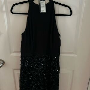 Black gown worn once , halter style top .  Beaded from waist to floor